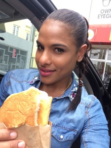 Yhordanka Akwanza with her favorite Jamaican food. patty and cocoa bread.