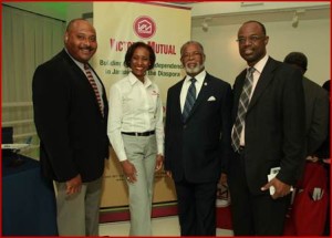 Above: Jamaica’s Consul General Herman G. LaMont (2nd right) and Alfred McDonald, (right)  Senior Director, Commercial Development and Planning, Norman Manley International Airport share the lens with Suzette Rochester, Florida Manager, Victoria Mutual Building Society and Andrew Lawrence, (left), President/Director of the Caribbean Trade Council Inc. in Hartford, CT. Photo credit: Kwabena Brown
