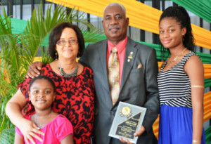 Howard Deers with his wife (2nd left) and his granddaughters. - Photo by  Marlon Tingling (JIS)