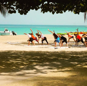 Yoga on the beach Fit Bodies Inc