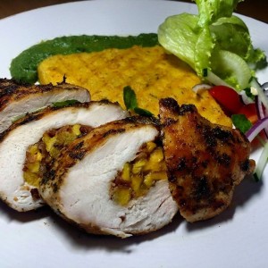 Bacon & plantain stuffed grilled chicken, with a roasted bell pepper puree; served with grilled polenta and a simple salad.