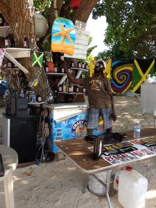 jamaica-dr-love standing in treebar-negril beaches-RappaRastaTours