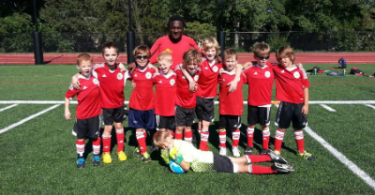 Jamaican-Born Ezron "Bobby" Austin with his Youth Soccer League team.