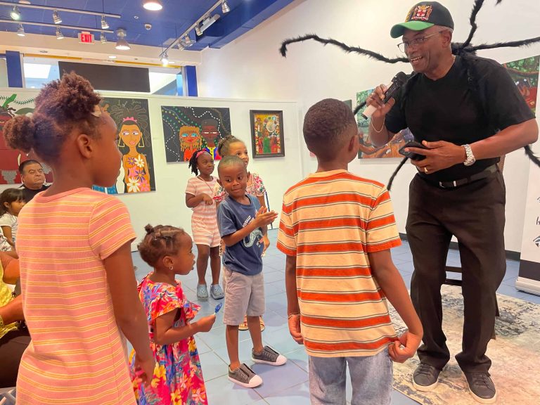 Patrick Brown as 'Bredda Anancy' interacting with kids at the 2024 Anancy Festival