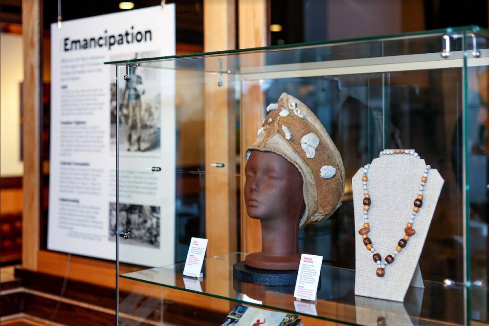A Jamaican Maroon Chieftainess' crown and a ceremonial healing necklace in the Emancipation display at Island SPACE Caribbean Museum | Photography by Island Syndicate