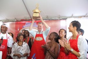 Mayor Bill de Blasio with trophy celebrates his 2015 victory over Kaci Fennell (right) as Former Congresswoman Una Clarke (left) and the Mayor’s wife Chirlane (third from left) join in.