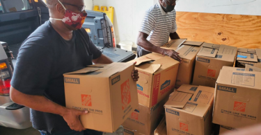 Jamaica Diaspora Groups School Supplies Drive - The team at Dennis Shipping Jamaica Limited preparing the palette for shipment