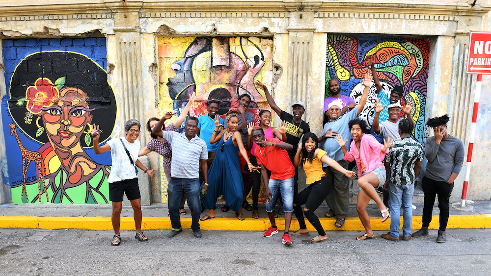 Jamaica Set to Open First Creative Hub in Downtown Kingston People at Mural by Stuart Reeves