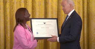 Jamaican American Nurse Who Was First In The USA To Be Vaccinated Honored By President