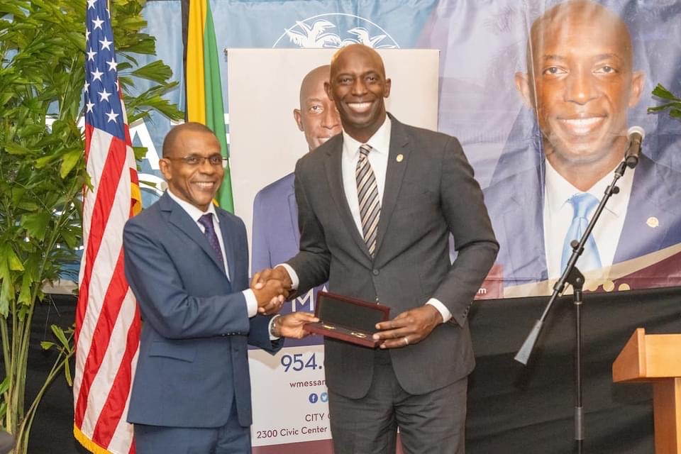 (L-R) Courtney Campbell, President & CEO VM Group being presented with the key to the city by Wayne Messam, Mayor City of Miramar