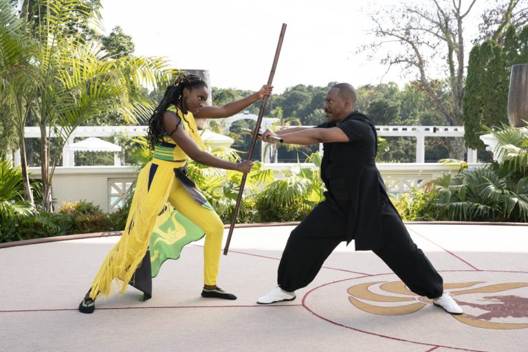Many Speculate the Jamaican Flag Outfit in Coming 2 America Was a Tribute to Madge Sinclair - Kiki Layne Meeka Akeem Eddie Murphy