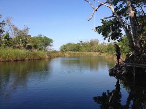 Black River Hidden gem man look in river_InspiringVibes