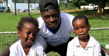 NFL Player Darius Butler Inspires Kids at Football Camp in Jamaica