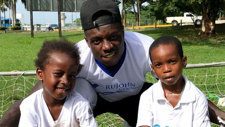 NFL Player Darius Butler Inspires Kids at Football Camp in Jamaica