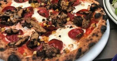 New York Pizza Spot Adds Oxtail Jerk Chicken Salt Fish Toppings to Pies