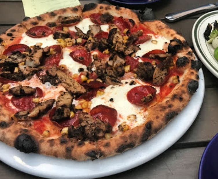 New York Pizza Spot Adds Oxtail Jerk Chicken Salt Fish Toppings to Pies