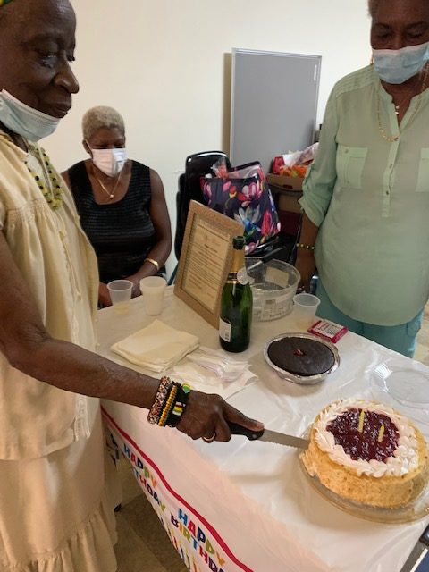 Vena cuts the cake - Jamaican Nonagenarian in New York Cited on Birthday